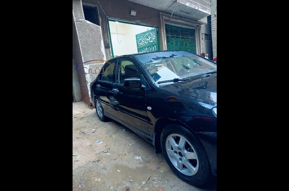 Lancer Puma Mitsubishi أسود