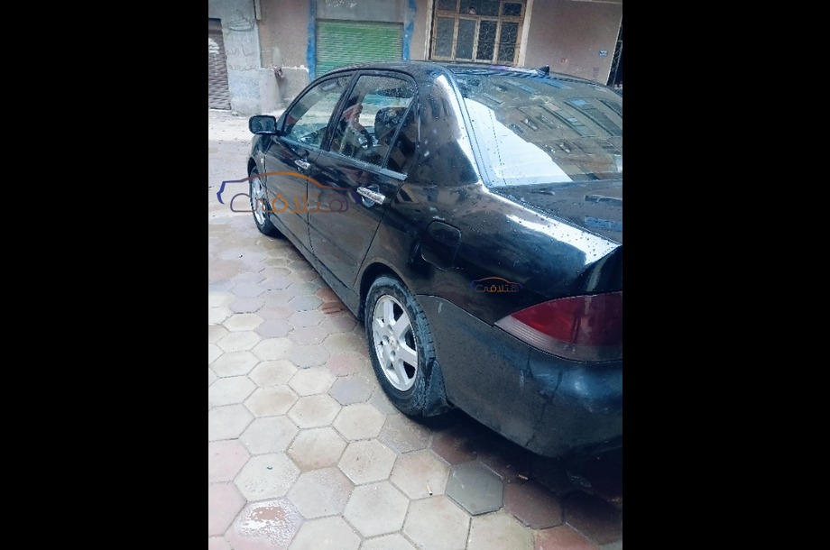 Lancer Puma Mitsubishi أسود