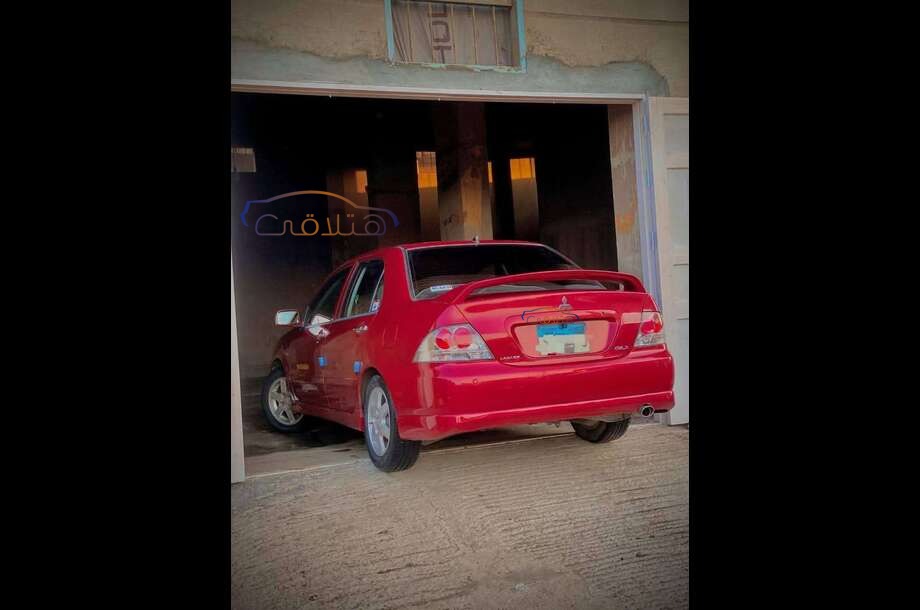 Lancer Puma Mitsubishi احمر