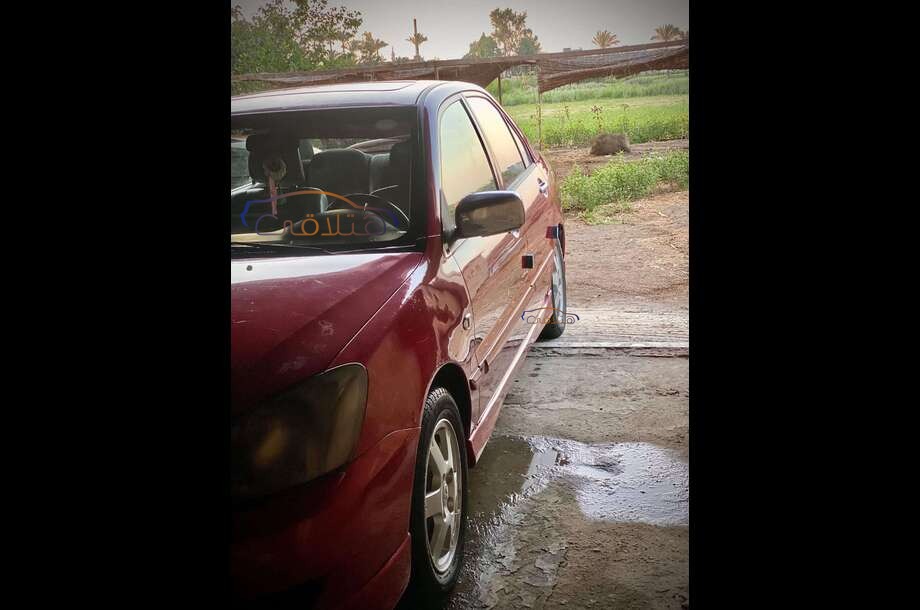 Lancer Puma Mitsubishi احمر