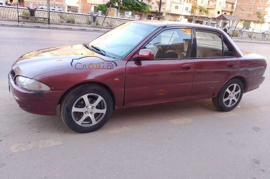 Wira Proton احمر غامق