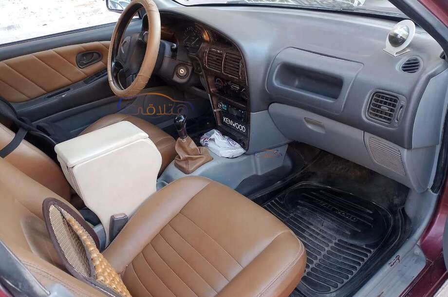 Wira Proton احمر غامق