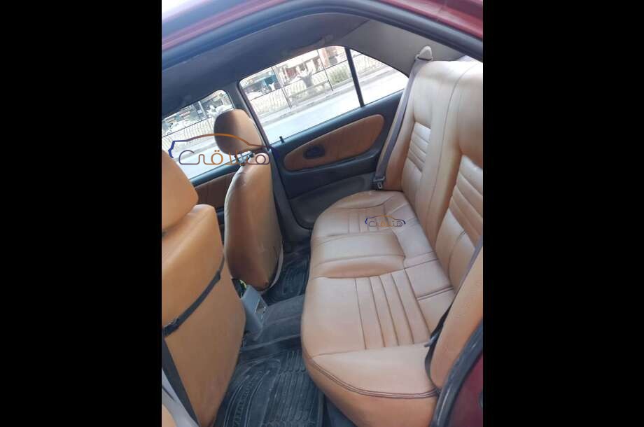 Wira Proton احمر غامق