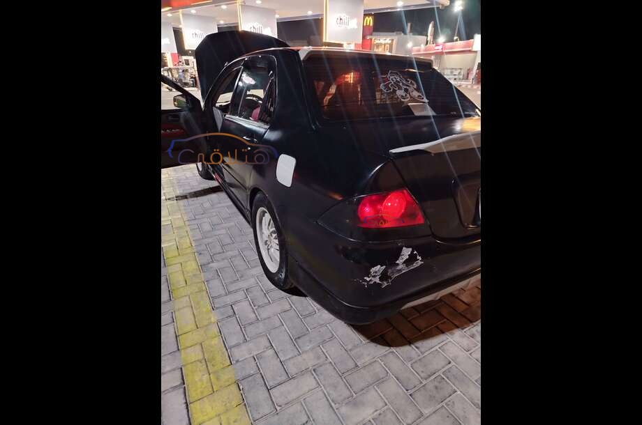 Lancer Puma Mitsubishi أسود