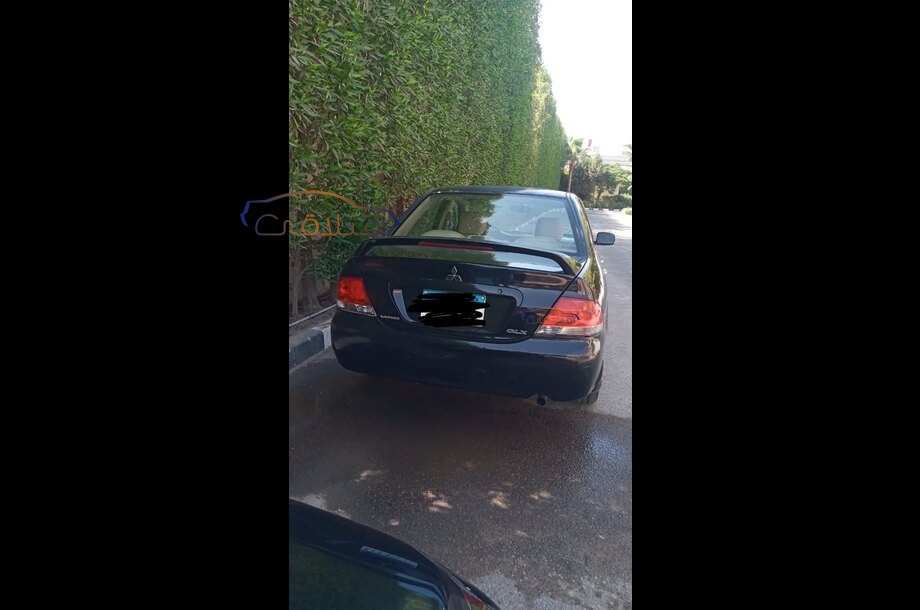 Lancer Puma Mitsubishi أسود