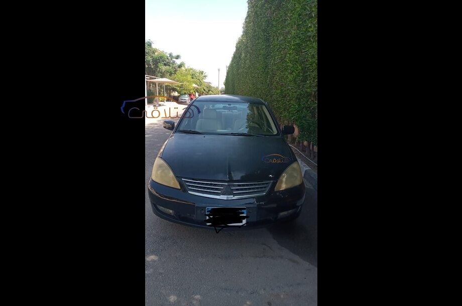 Lancer Puma Mitsubishi أسود