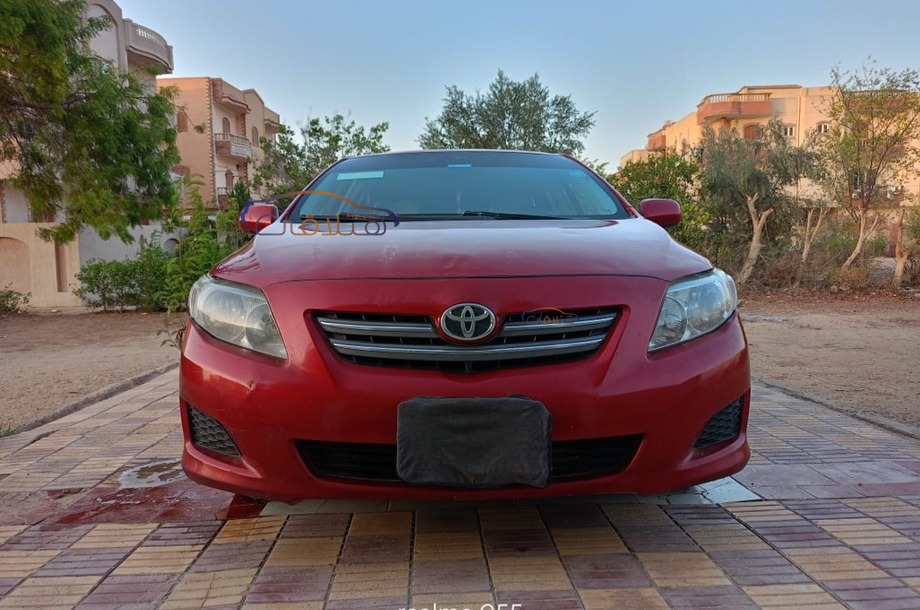 Corolla Toyota احمر غامق