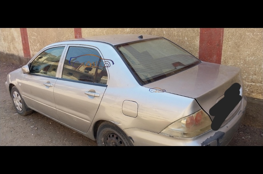 Lancer Puma Mitsubishi فضي