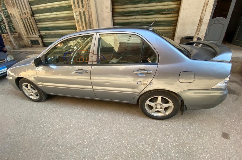 Lancer Puma Mitsubishi فضي