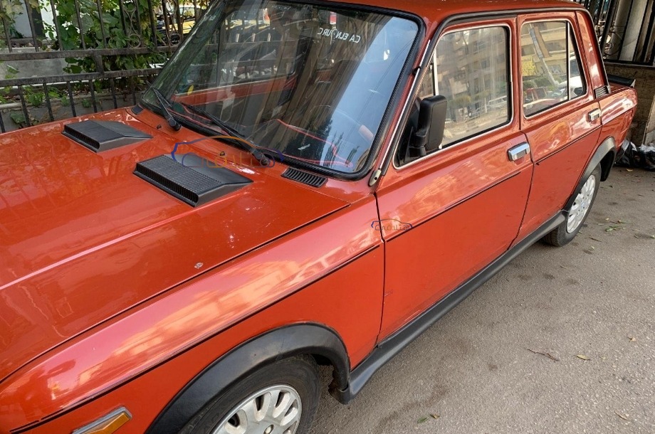 128 Fiat Dark red