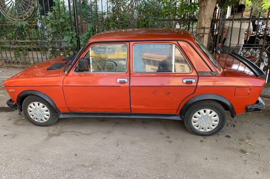 128 Fiat Dark red
