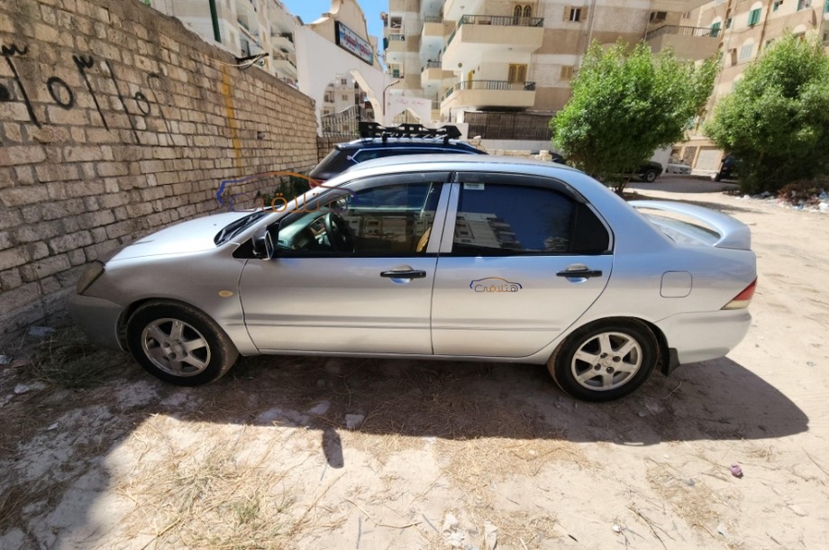 Lancer Puma Mitsubishi فضي