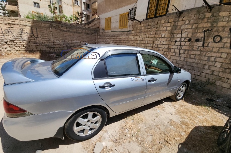 Lancer Puma Mitsubishi فضي