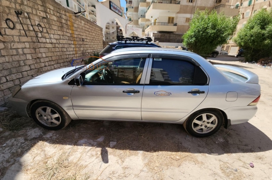 Lancer Puma Mitsubishi فضي