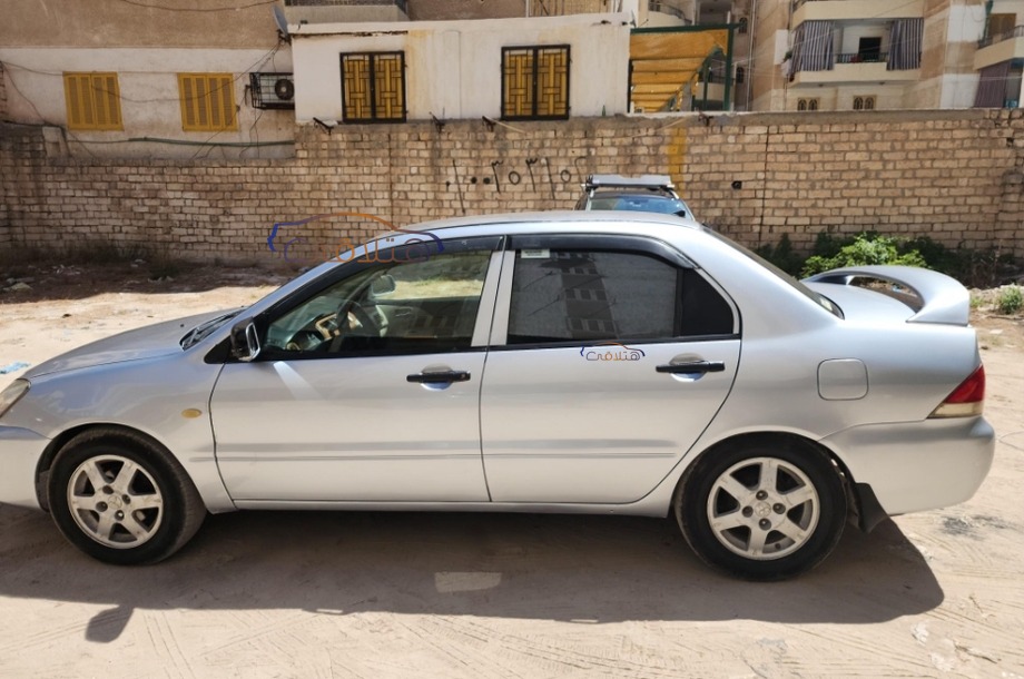 Lancer Puma Mitsubishi فضي