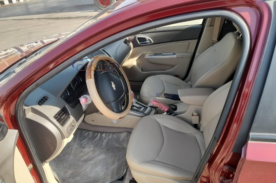 Optra Chevrolet احمر غامق